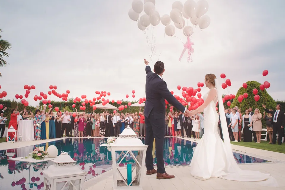 Wedding guests celebrating together at an evening reception