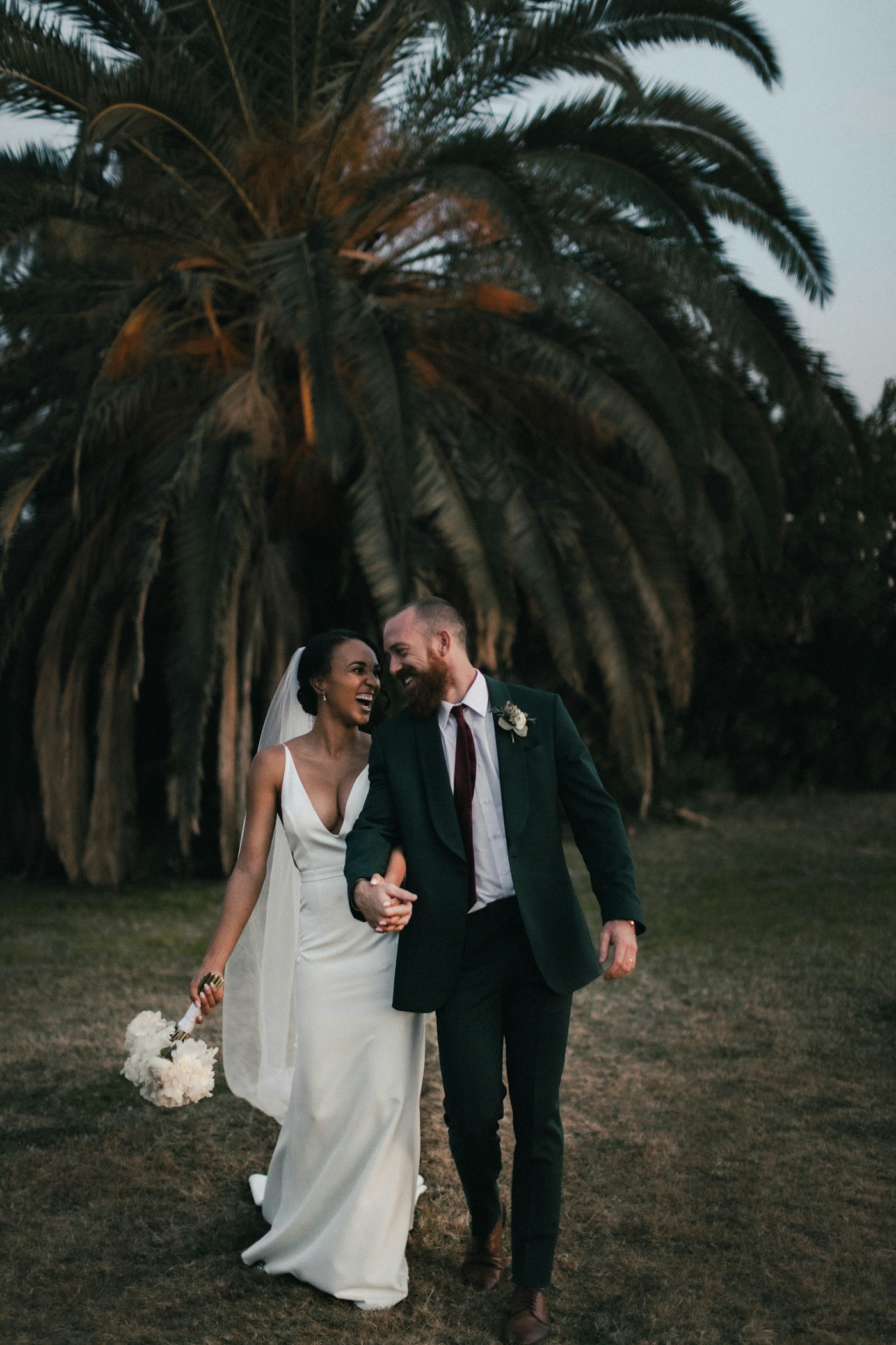 Wedding planning notes beside flowers and stationery